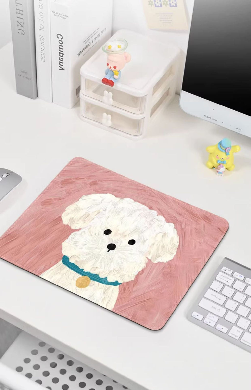 Desk setup featuring cute cartoon mouse pad