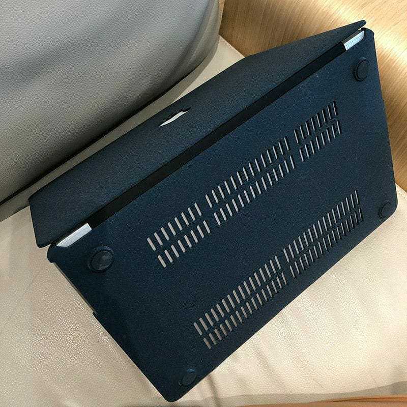 Gray MacBook case with sandstorm texture design