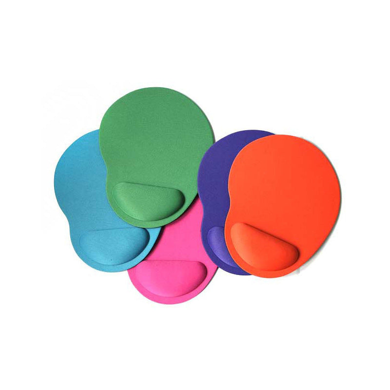 Pink wrist support pad on computer setup