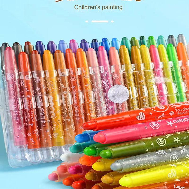 Children using colourful crayons for drawing