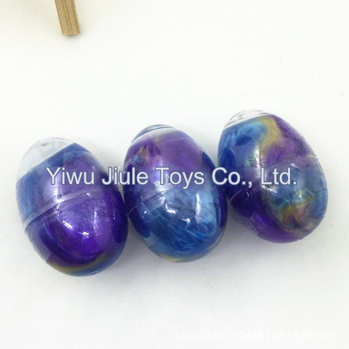 Galaxy themed slime eggs in a colourful box