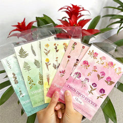 Crafting journals decorated with floral stickers
