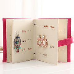 Compact jewellery holder on a shelf