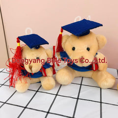 Plush graduation bear doll wearing a graduation cap