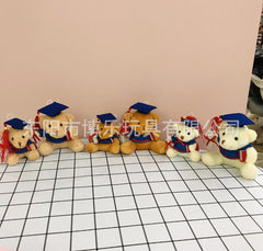 Dark brown plush bear with graduation cap