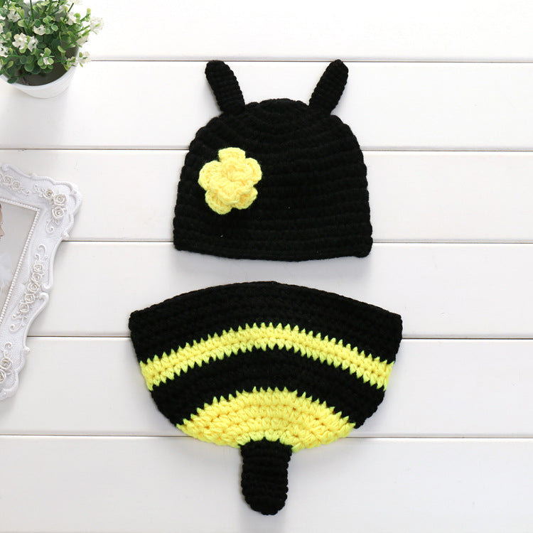 Handcrafted bee-shaped photography prop in yellow and black