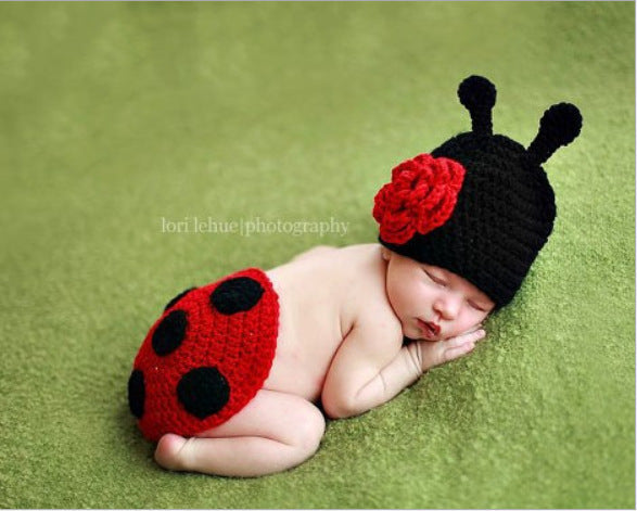 Beetle embellishment on newborn clothing