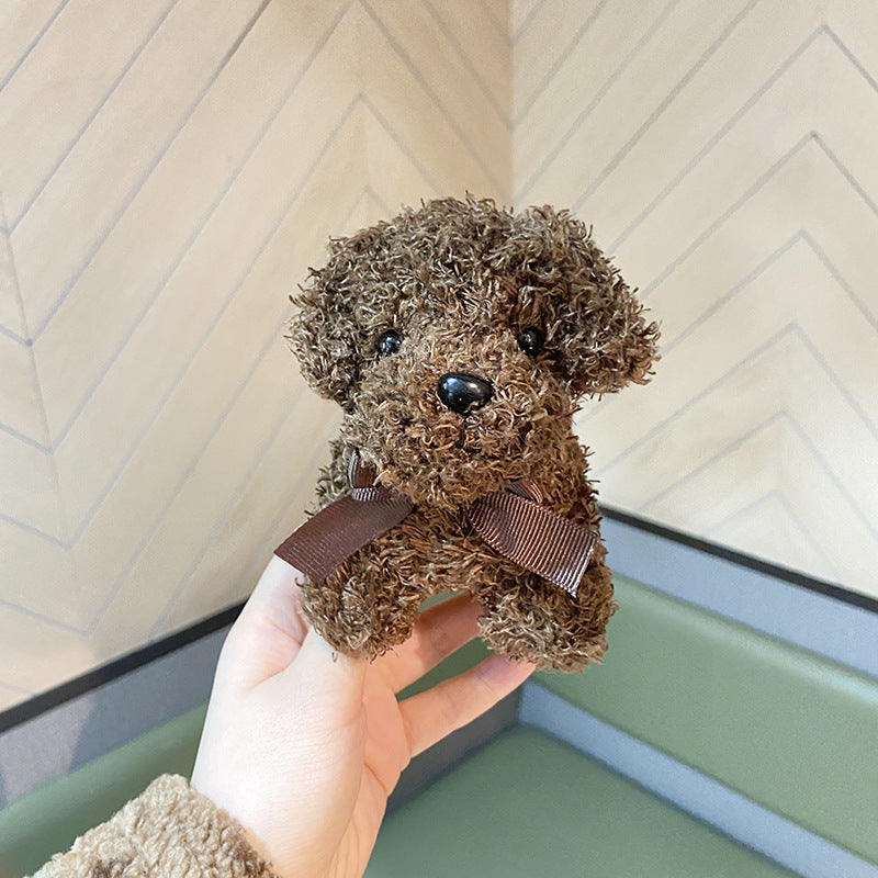 Realistic Teddy Bear Dog Keychain on Table