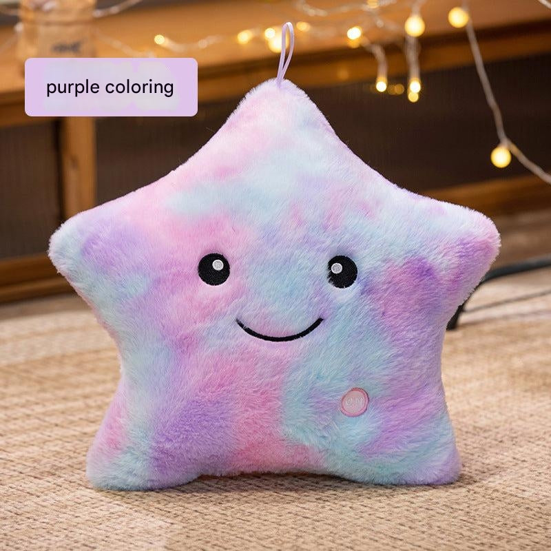 Cuddly star-shaped pillow on bed