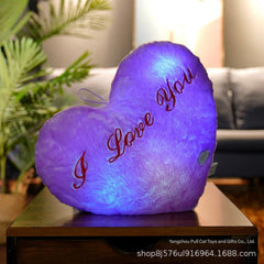 Cuddly star-shaped pillow on bed