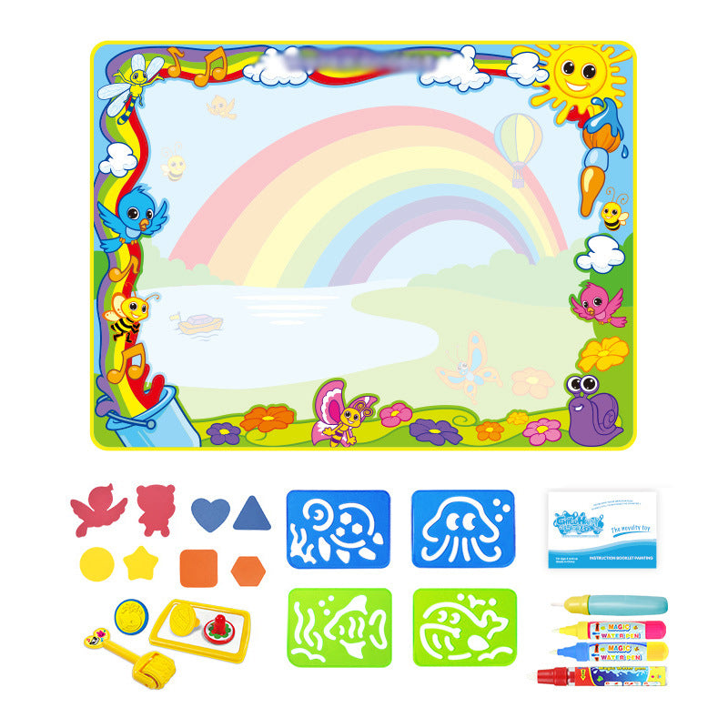 Happy child using a colourful water doodle mat