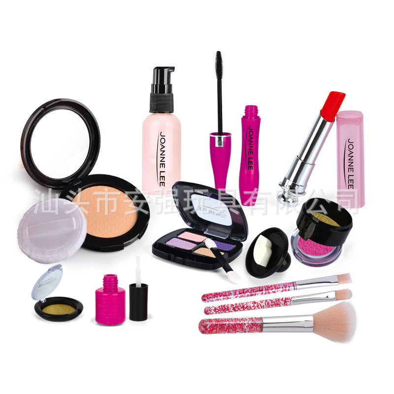 Close-up of lipstick and brushes in toy kit