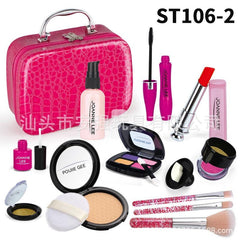 Close-up of lipstick and brushes in toy kit
