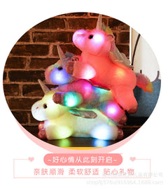 Glowing Unicorn Plush Toy glowing at night