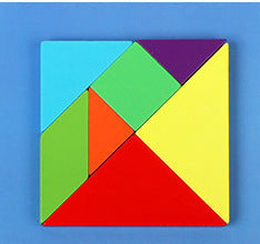 Children playing with colorful magnetic tangram pieces