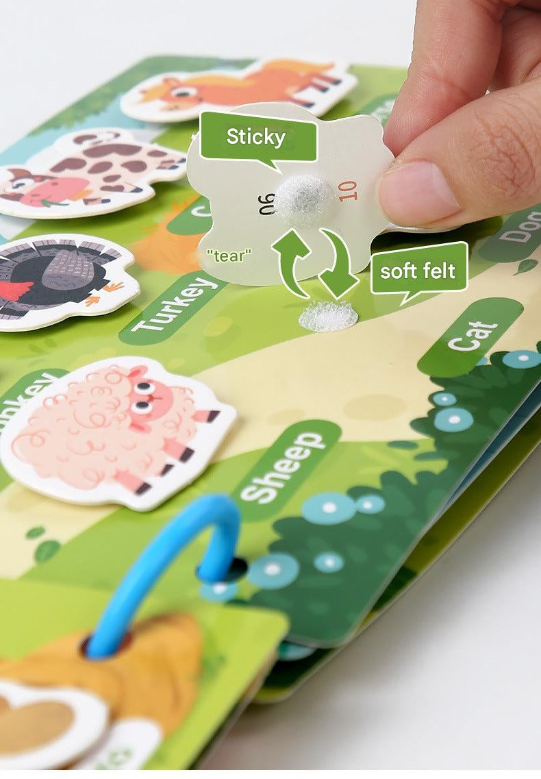Toddler engaging with quiet book kit