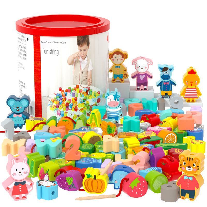 Close-up of kids playing with bead stringing blocks