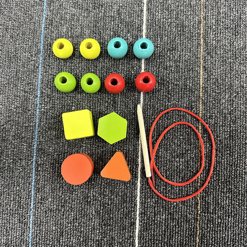 Stringing beads and blocks for fine motor skills