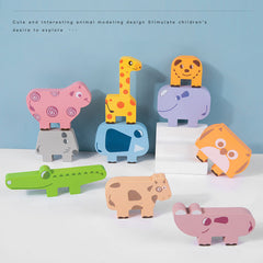 Child playing with wooden animal balance game set