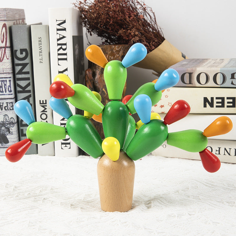 Child's hands assembling wooden cactus puzzle