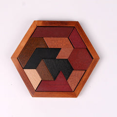 Toddler manipulating wooden puzzle pieces