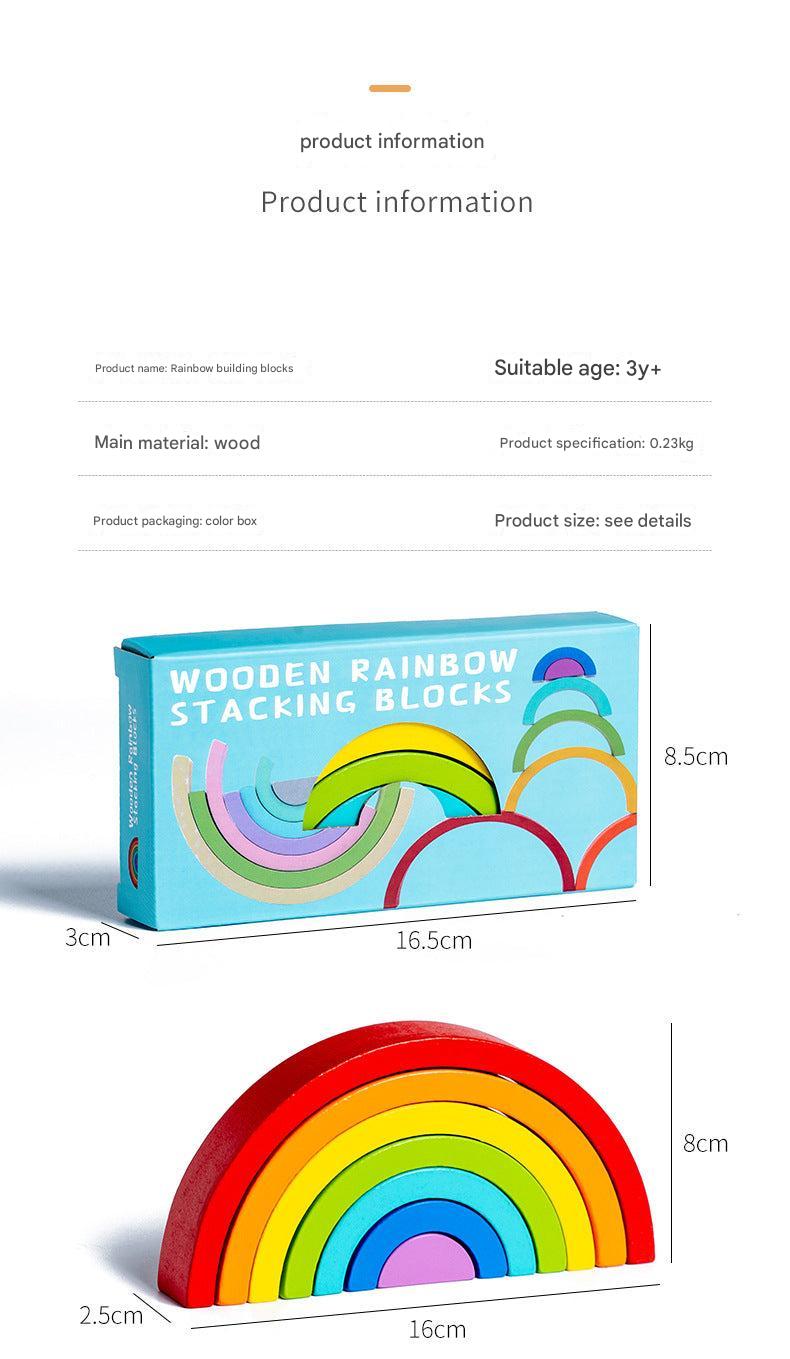 Person demonstrating a stacking challenge with rainbow toy