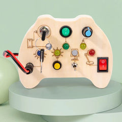 Wooden Busy Board showing LED lights and switches