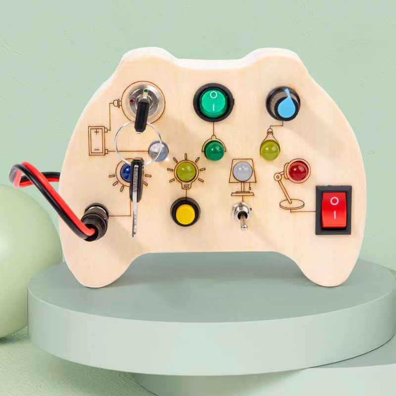Wooden Busy Board showing LED lights and switches