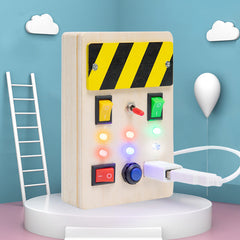 Child's hands on the Busy Board's features