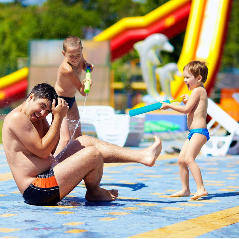 Children playing with foam water guns at the beach 2