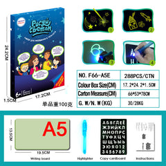 Child drawing on the glow pad in a dark environment