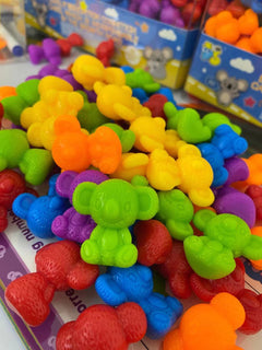 Children playing with colourful counting toys