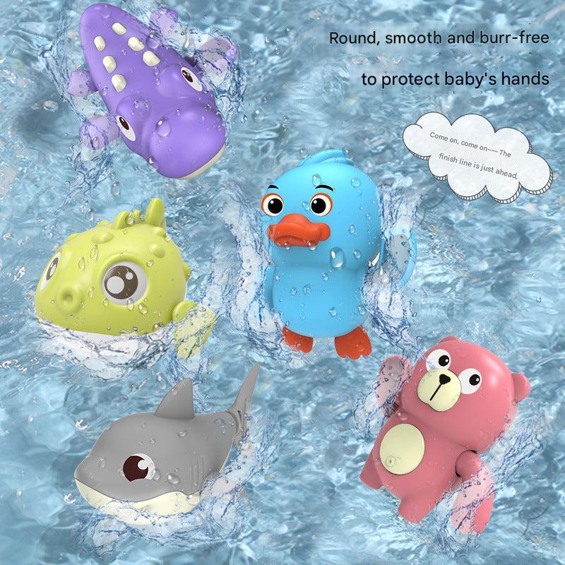 Toddler playing with a colourful swimming toy