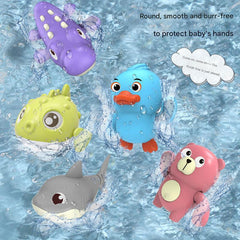 Toddler playing with a colourful swimming toy