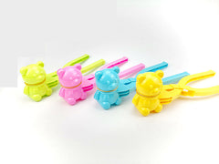 Group of kids playing with Dinosaur Snowball Maker