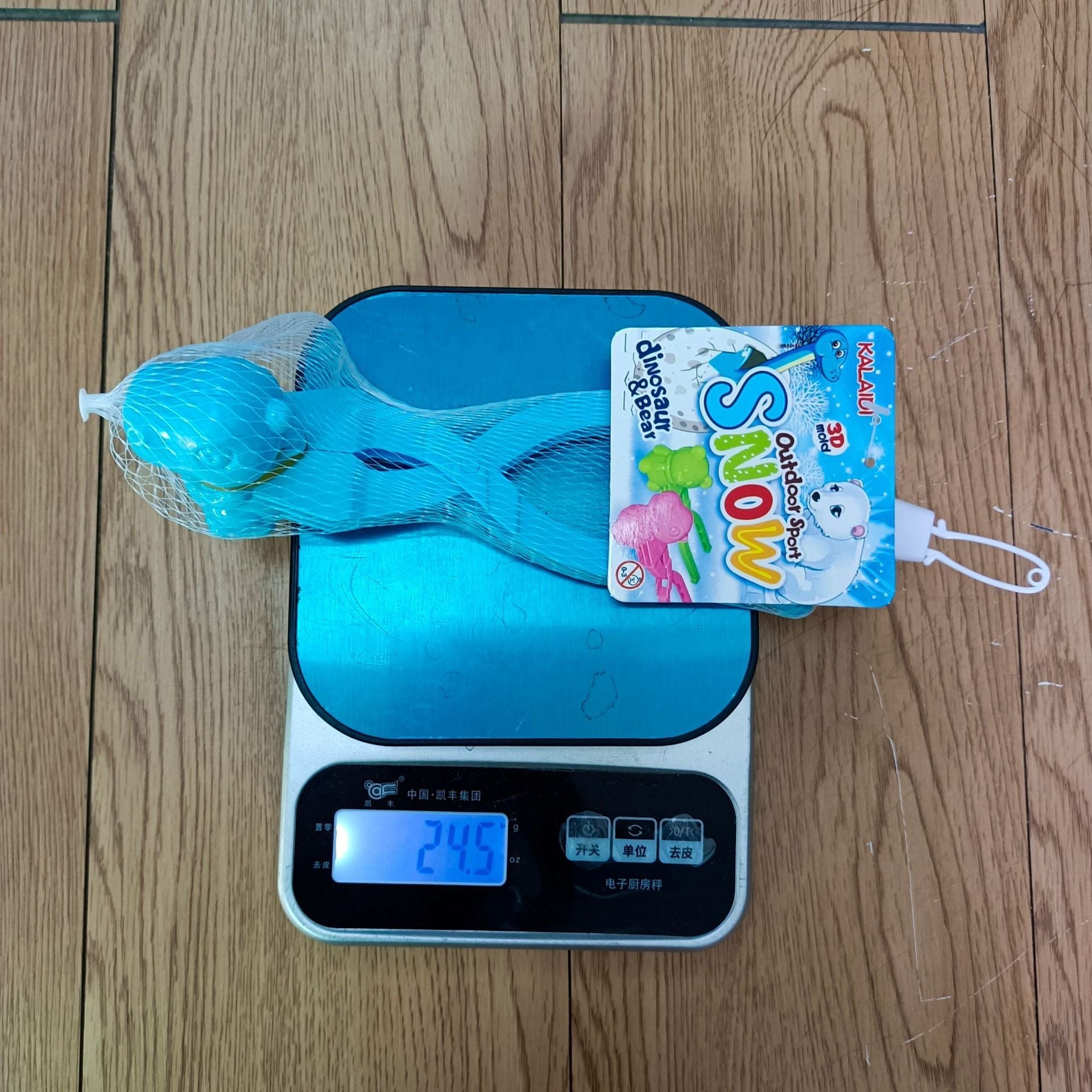 Child using Cartoon Dinosaur Snowball Maker