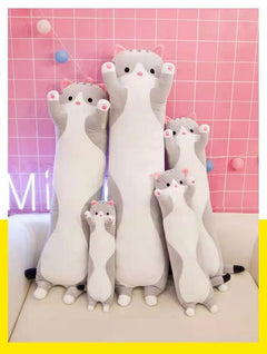 Plush cat pillow in a cozy setting