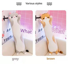 Plush cat pillow in a cozy setting