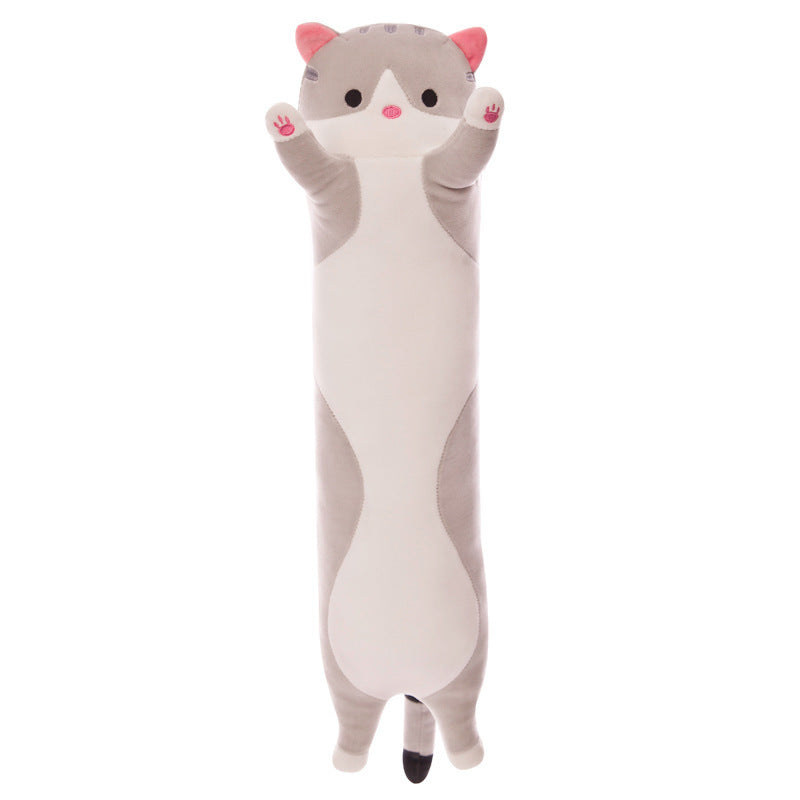 Plush cat pillow in a cozy setting
