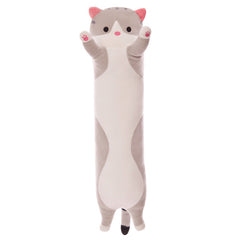 Plush cat pillow in a cozy setting
