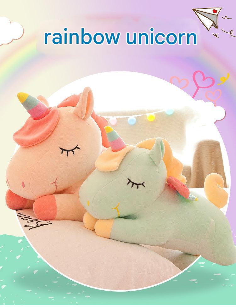 Angel Unicorn Plush Toy sitting on a soft surface
