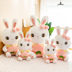 Soft Peach Bunny Plush Toy on a bed