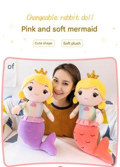 Mermaid pillow doll on colorful bedding