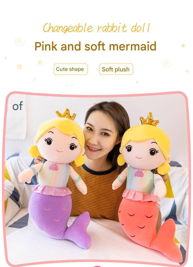 Mermaid pillow doll on colorful bedding