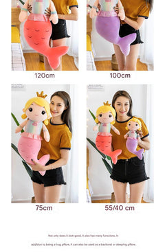 Child hugging the plush mermaid doll