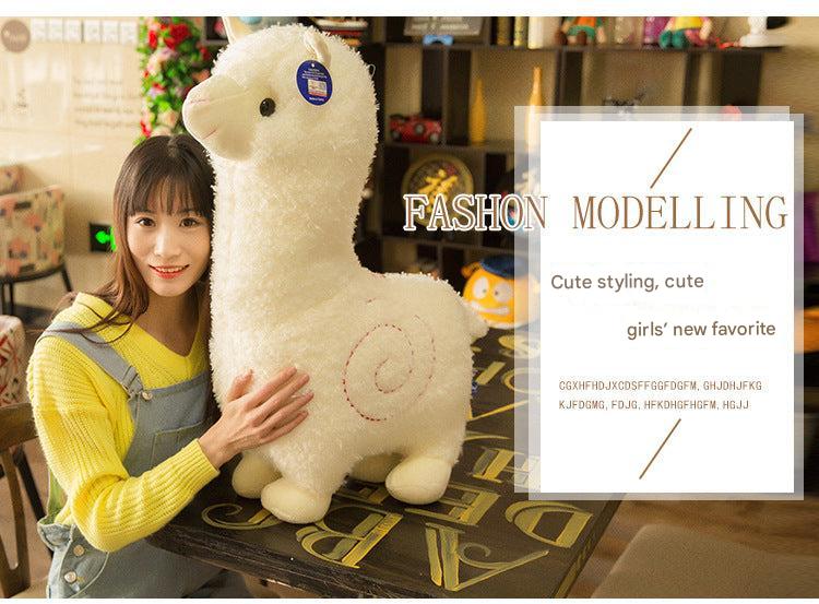Fluffy alpaca toy in a decorative setup