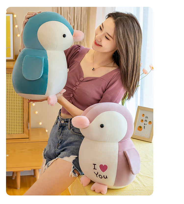 Cuddly Penguin Plush Toy in a playful setting image 3