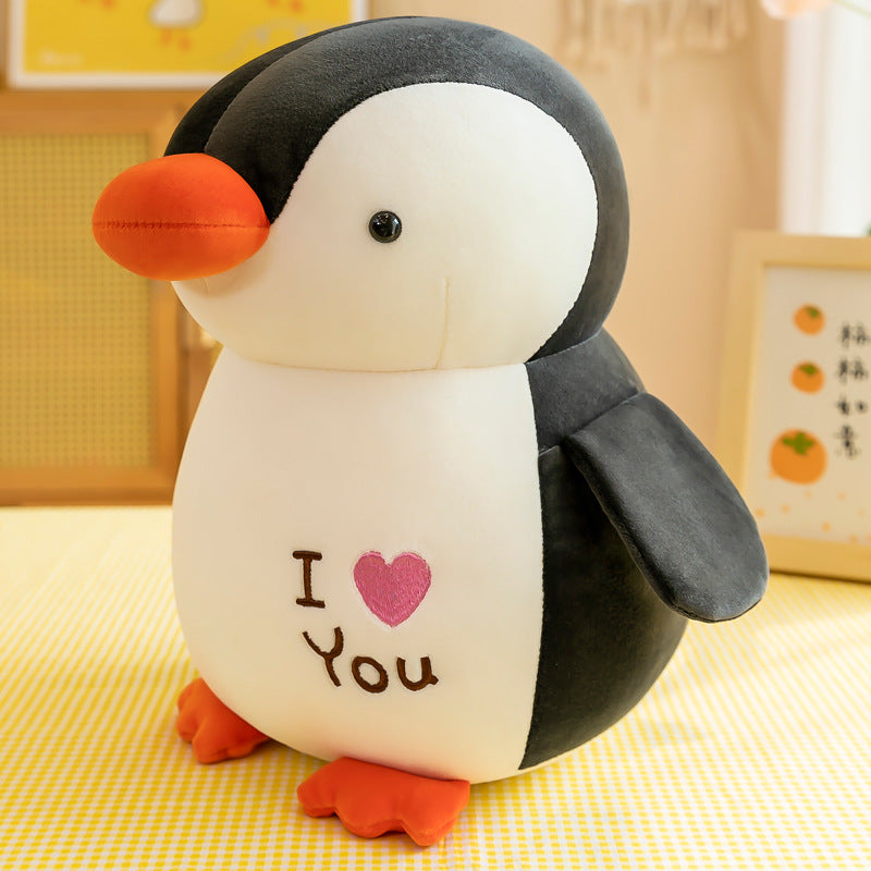 Cuddly Penguin surrounded by toys image 7