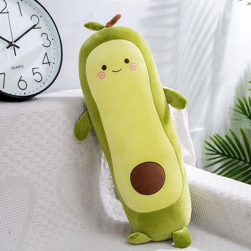 Elegant avocado plush doll on a styled couch