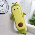 Elegant avocado plush doll on a styled couch